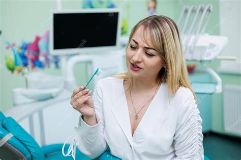 Premium Photo The Dentist Is In His Dental Office Dentist Woman In A