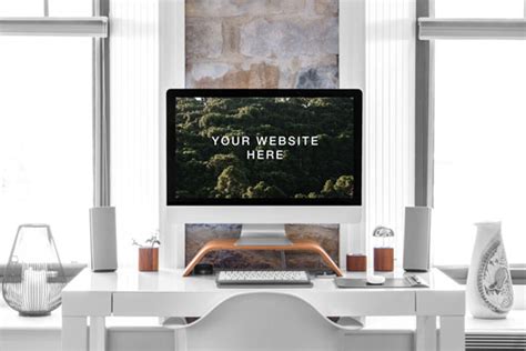 Mockup Featuring Realistic IMac On A Desk Next To A Lamp And A Plant