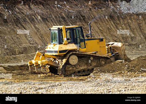 Bulldozer is working at the road construction Stock Photo - Alamy