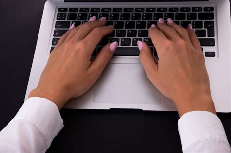 Premium Photo Woman S Hands Using A Laptop In The Office