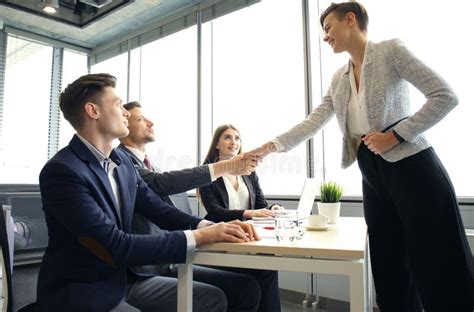 Job Applicant Having Interview Handshake While Job Interviewing Stock