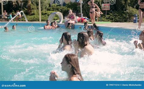 Cheerful Girls In Bikini Jumping In The Pool And Laughing Stock Footage