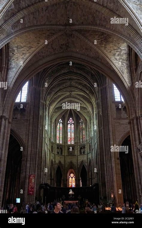 Stained glass windows above the altar in the nave of Bordeaux Cathedral ...