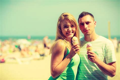 Man And Woman Eating Ice Cream On Beach Stock Photo Image Of Lovers