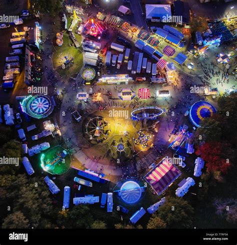 Aerial view of illuminated colorful amusement park Stock Photo - Alamy