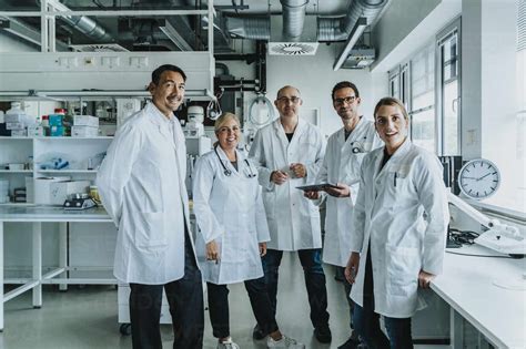 Confident Scientist Team Standing Together At Laboratory Stock Photo