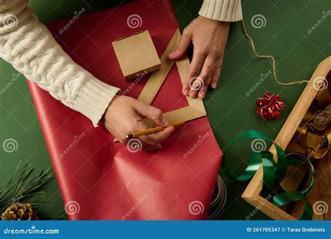 Female Hands Using A Wooden Pencil And Triangular Ruler Draw On T