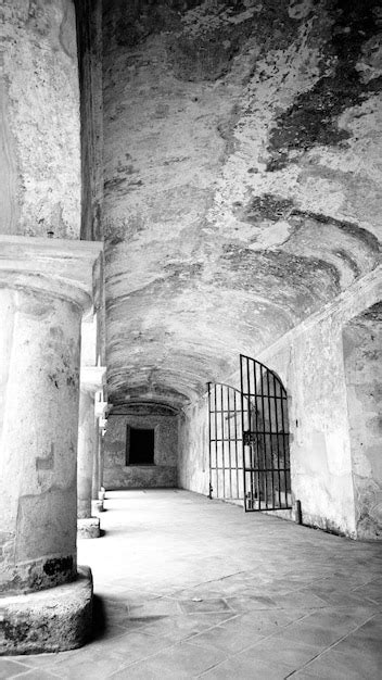 Premium Photo | Open gate in corridor of old prison