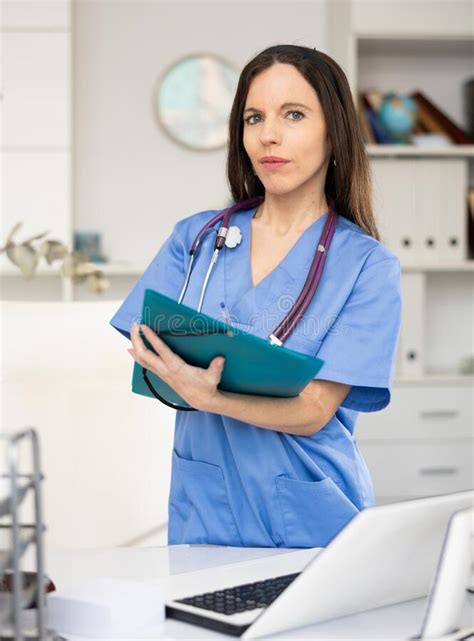 Portrait Of Female Doctor With Folder Stock Image Image Of Spanish