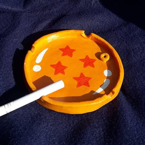 An Orange Plate With Red Stars On It And A White Marker In The Middle