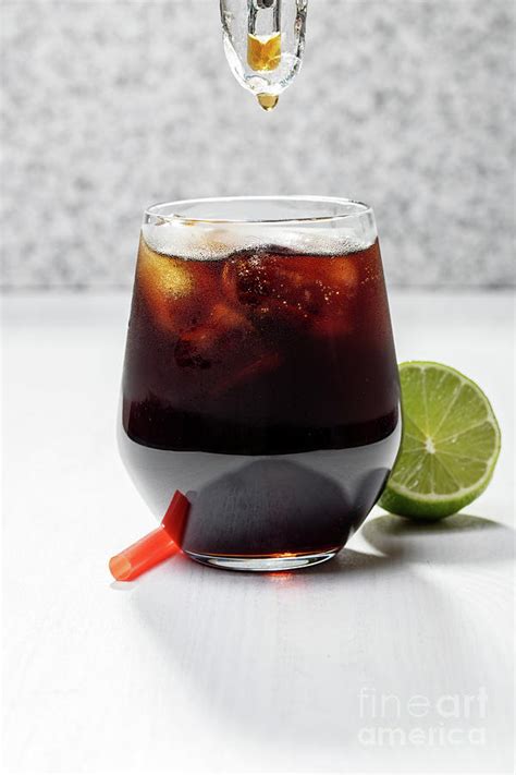 Glass of coca cola with ice cubes Photograph by Piotr Marcinski - Fine ...