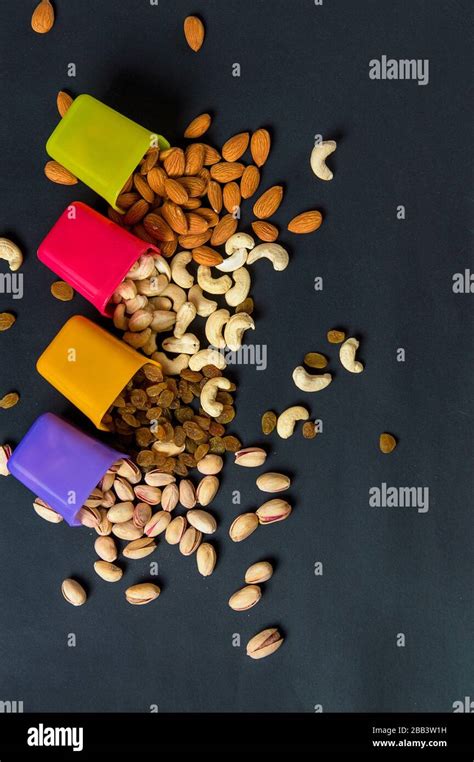 Healthy Mix Dry Fruits And Nuts On Dark Background Almonds Pistachio