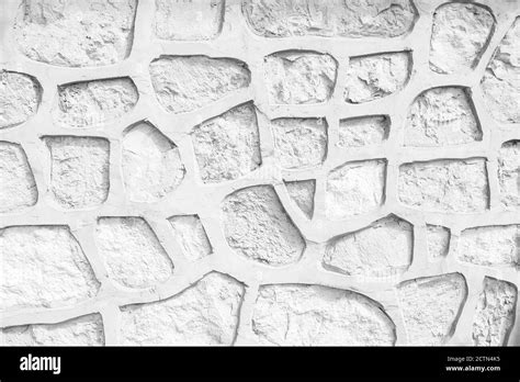 Background of white broken stone wall texture Stock Photo - Alamy