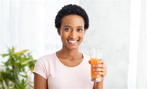 Healthy Eating And Detox Concept Smiling Black Woman With Glass Of