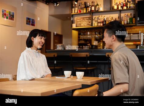 Japanese Couple At A Cafe Stock Photo Alamy