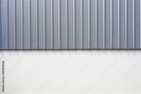 Corrugated metal panel cladding of a warehouse building Stock Photo ...