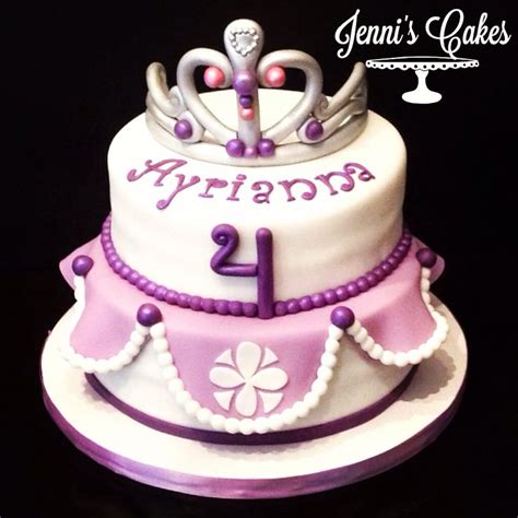 a purple and white cake with a tiara on top that says arrigan