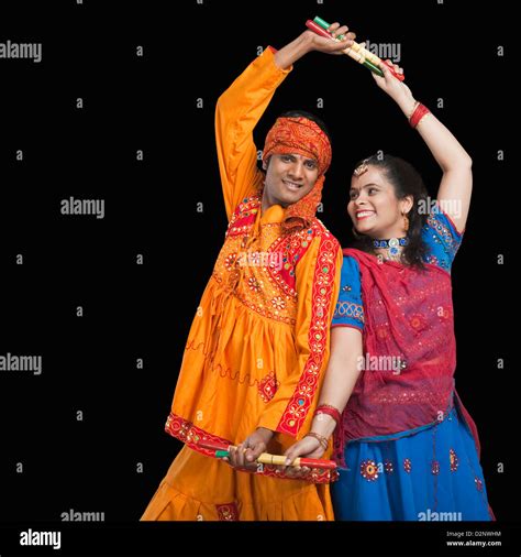 Couple Performing Dandiya Stock Photo Alamy