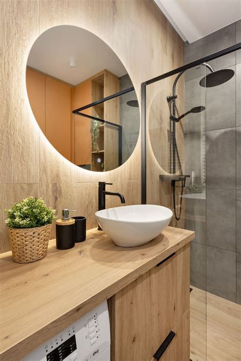 A Bathroom With A Sink Mirror And Shower