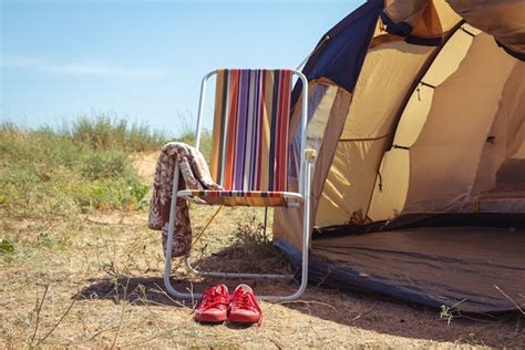 Premium Photo | Chair oand a tent. Camping.