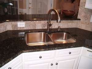 solid surface countertops with under mount sink | Single hole kitchen ...