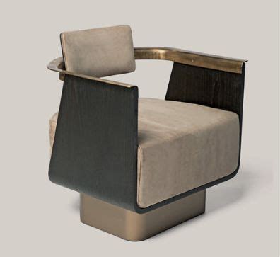 A Black And Beige Chair Sitting On Top Of A White Floor