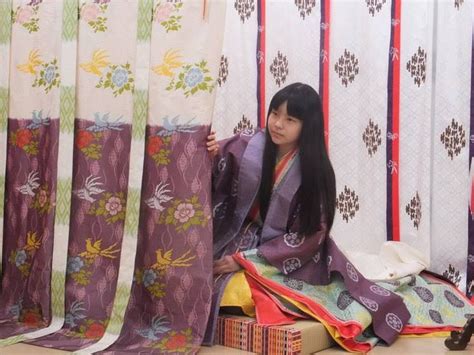 A Woman Dressed In Junihitoe Sitting Behind A Standing Curtain Heian