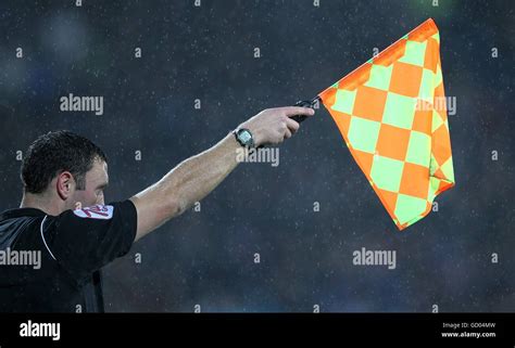 The Referee S Assistant Raises His Flag For An Offside Stock Photo Alamy