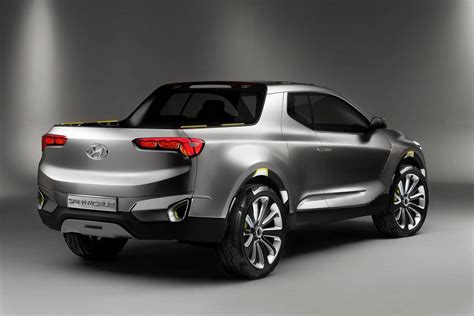 pickup truck news hyundai santa cruz cruises  tesla