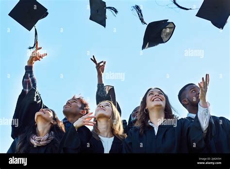 High School Graduation Hats In The Air