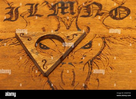 Ouija Board In Pyrographed Wood Stock Photo Alamy