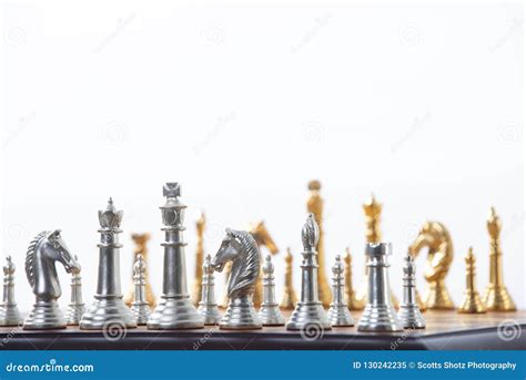 Gold and silver chess set stock image. Image of teamwork - 130242235