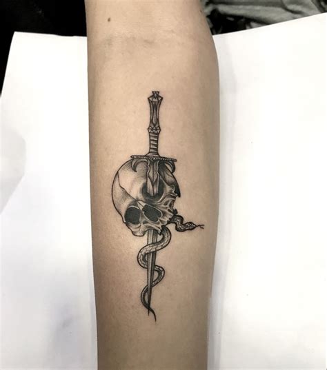 Skull And Sword Tattoo