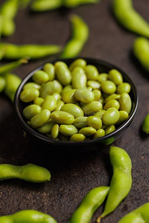 Green Edamame Pods Fresh Soybeans In Bowl On Black Table Stock Photo