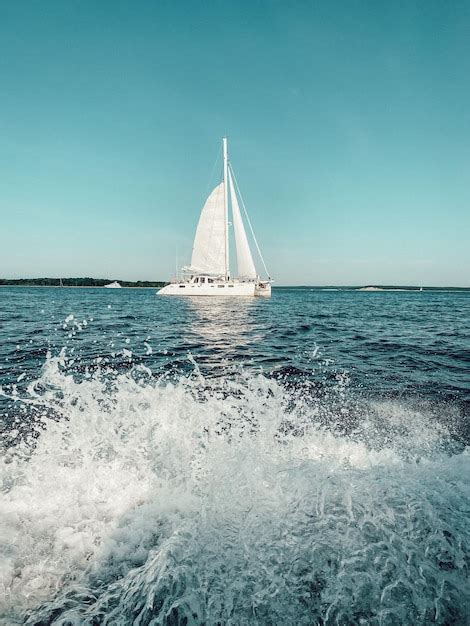 Premium Photo A Sailboat With A White Sail And The Word Sail On It