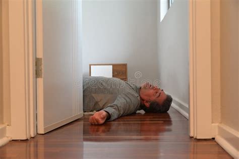 Mature Adult Man Lying On Bedroom Floor Unconscious Stock Image Image Of Disease Health