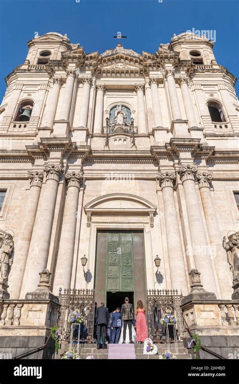 A Wedding Takes Place Beneath The Imposing C Facade Of The Church Of