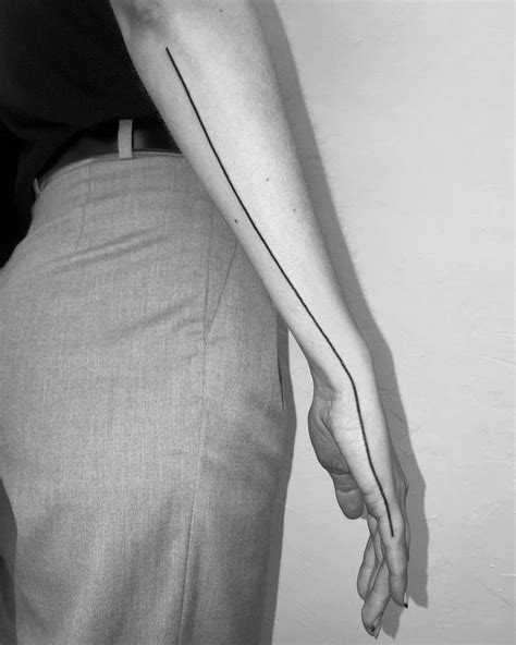 Tattoo Of A Line Done On The Forearm