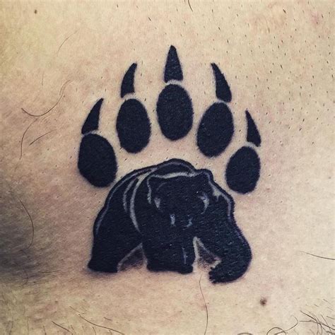 Cute Bear Claw Tattoo In The Bold Black Tribal Bear Tattoo Bear Paw