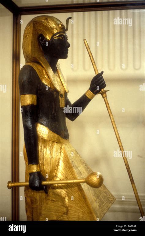 Gilded wooden statue of a black Nubian figure Egyptian Museum of ...