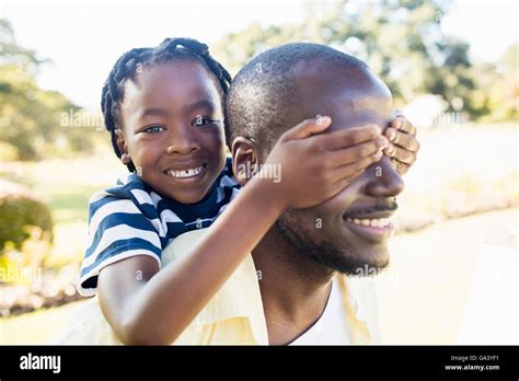 Happy family enjoying together Stock Photo - Alamy