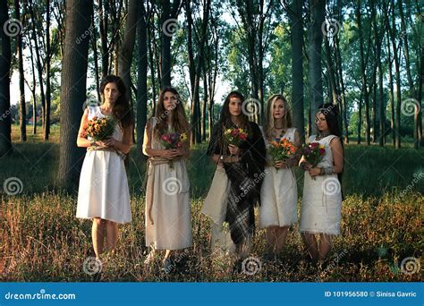 Pagan Women In The Forest Holding Flowers Stock Photo Image Of Magic