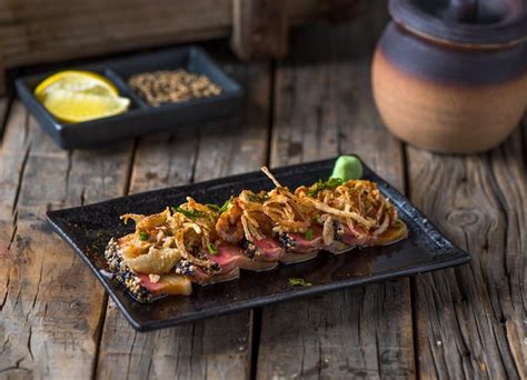 Premium Photo Hamachi Tataki Served In A Dish Isolated On Wooden