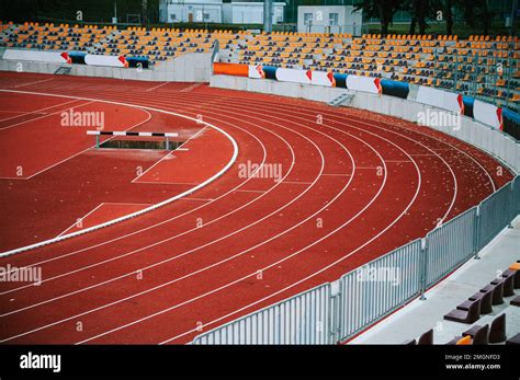 Modern empty athletics stadium showcasing state-of-the-art architecture ...