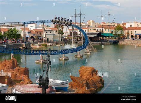 Rollercoaster Loop Over A Lake In Port Aventura Amusement Park Salou