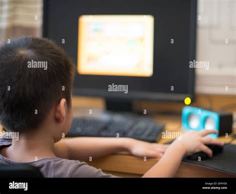 Kid Playing A Computer Game For Children At Home Stock Photo Alamy