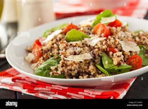 Healthy Vegetarian Quinoa Salad With Tomatoes And Spinach Stock Photo