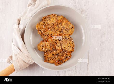 Crispy Weiner Schnitzel With Sesame Seeds In A Pan From Above Chicken