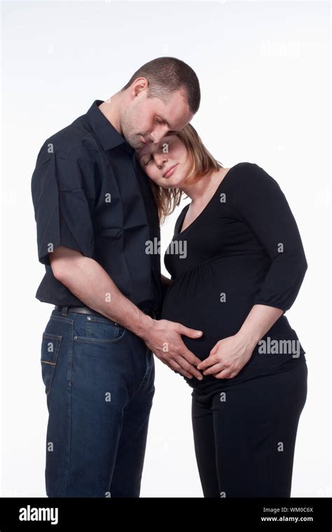 Happy Expecting Couple Holding Each Other Isolated On White Stock