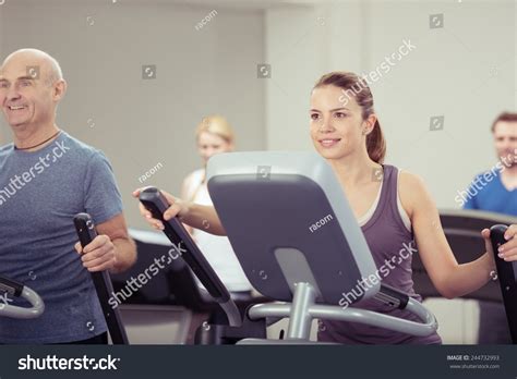diverse group people exercising gym focus stock photo